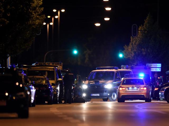 Police stand in a small street following a shooting rampage at the Olympia shopping mall in Munich, Germany July 23, 2016. Austria has increased security along its border with Germany following the Munich attack. (REUTERS) Police stand in a small street following a shooting rampage at the Olympia shopping mall in Munich, Germany July 23, 2016. Austria has increased security along its border with Germany following the Munich attack. (REUTERS)