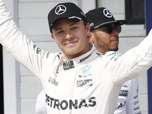First placed Mercedes AMG Petronas F1 Team's German driver Nico Rosberg (C) celebrates his pole position. (AFP Photo) First placed Mercedes AMG Petronas F1 Team's German driver Nico Rosberg (C) celebrates his pole position. (AFP Photo)