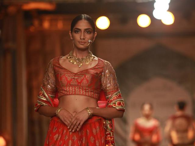 Jewellery can play a big part in how you complete a look. Why not go for gilded pieces to offset the whites and mild ochres of your weddingwear. Time to experiment, guys!  (Amal KS/ HT Photo) 