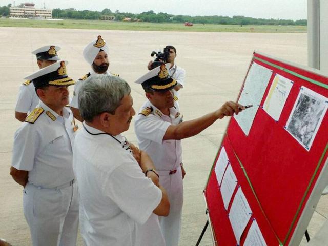 Defence minister Manohar Parrikar being briefed on the search operations of missing IAF AN-32 aircraft at Naval Air Station, Arakkonam on Saturday. (PTI) Defence minister Manohar Parrikar being briefed on the search operations of missing IAF AN-32 aircraft at Naval Air Station, Arakkonam on Saturday. (PTI)