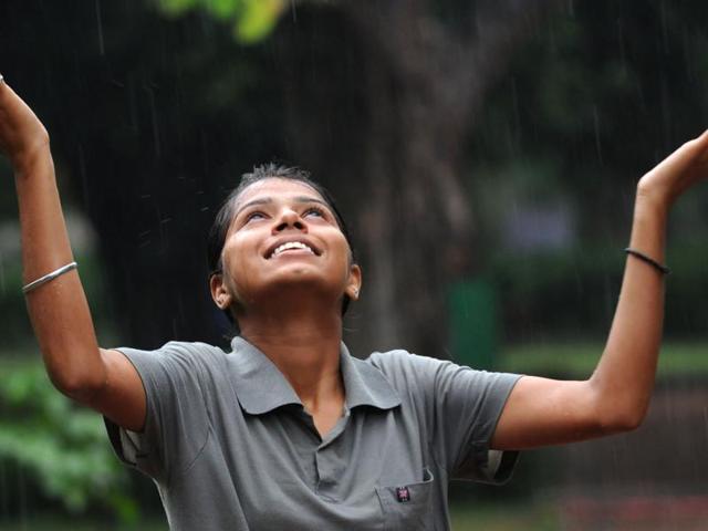 A Girl enjoying the sudden rainfall in Patiala on Saturday. (Bharat Bhushan/HT Photo) A Girl enjoying the sudden rainfall in Patiala on Saturday. (Bharat Bhushan/HT Photo)