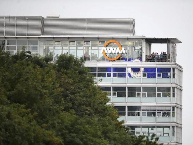 People stand on a balcony of a building overlooking the scene of a shooting rampage at the Olympia shopping mall in Munich. (REUTERS) People stand on a balcony of a building overlooking the scene of a shooting rampage at the Olympia shopping mall in Munich. (REUTERS)
