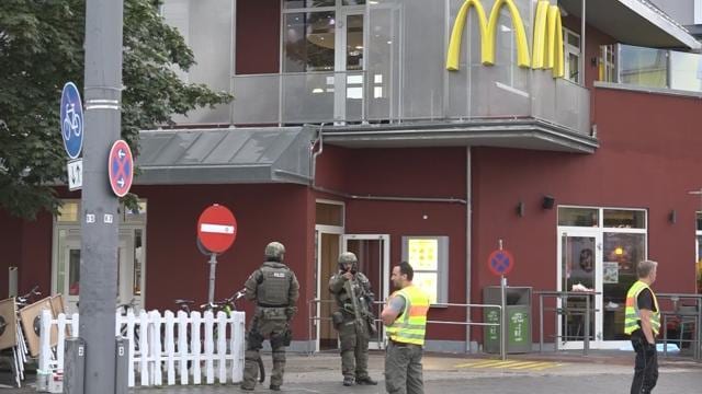 A screen grab taken from video footage shows special forces police officers standing guard next to a fast foot restaurant following a shooting rampage at the Olympia shopping mall in Munich. (Reuters Photo) A screen grab taken from video footage shows special forces police officers standing guard next to a fast foot restaurant following a shooting rampage at the Olympia shopping mall in Munich. (Reuters Photo)