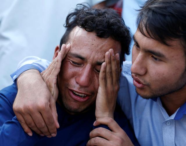 An Afghan man weeps outside a hospital after a suicide attack in Kabul. (REUTERS) An Afghan man weeps outside a hospital after a suicide attack in Kabul. (REUTERS)