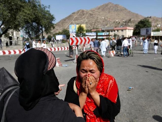 An Afghan woman weeps at the site of a suicide attack in Kabul.(Reuters)