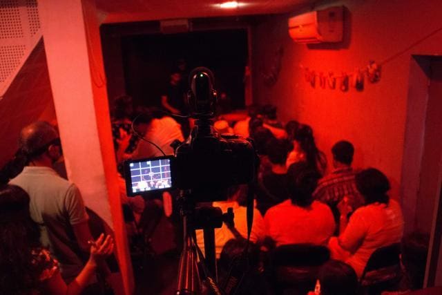 The Darkroom Project refers directly to a darkroom, where photographs are developed. The drama takes place in partial darkness; only a red light illuminates the stage. The Darkroom Project refers directly to a darkroom, where photographs are developed. The drama takes place in partial darkness; only a red light illuminates the stage.