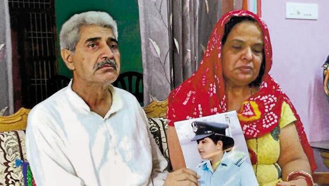 The parents of flight lieutenant Deepika Sheoran showing her picture at their house in Loharu, Bhiwani, on Saturday. (Manoj Dhaka/HT Photo) The parents of flight lieutenant Deepika Sheoran showing her picture at their house in Loharu, Bhiwani, on Saturday. (Manoj Dhaka/HT Photo)