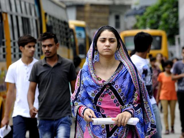 Applicants stepping out of the examination centre after appearing for NEET 2 exam in Noida on Sunday. (Sunil Ghosh / Hindustan Times) Applicants stepping out of the examination centre after appearing for NEET 2 exam in Noida on Sunday. (Sunil Ghosh / Hindustan Times)
