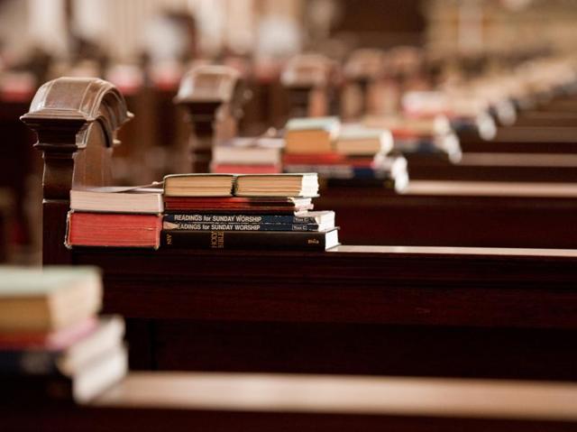Books stacked on desks inside the church.  (Gurinder Osan/HT Photo) 