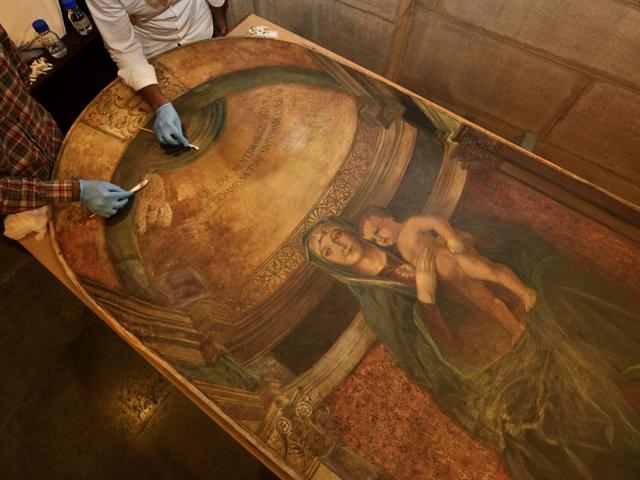 Restoration work includes cleaning paintings through a special process. (Gurinder Osan/HT Photo) 