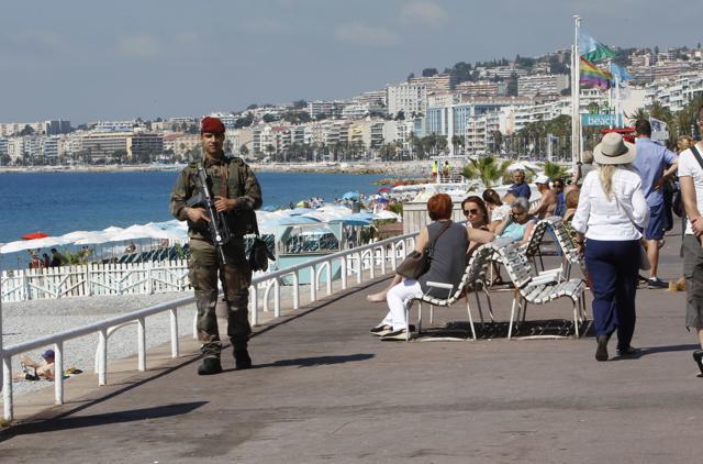A soldier secures the Promenade des Anglais in Nice, southern France, Monday, two days after the Bastille Day attack. (AP) A soldier secures the Promenade des Anglais in Nice, southern France, Monday, two days after the Bastille Day attack. (AP)