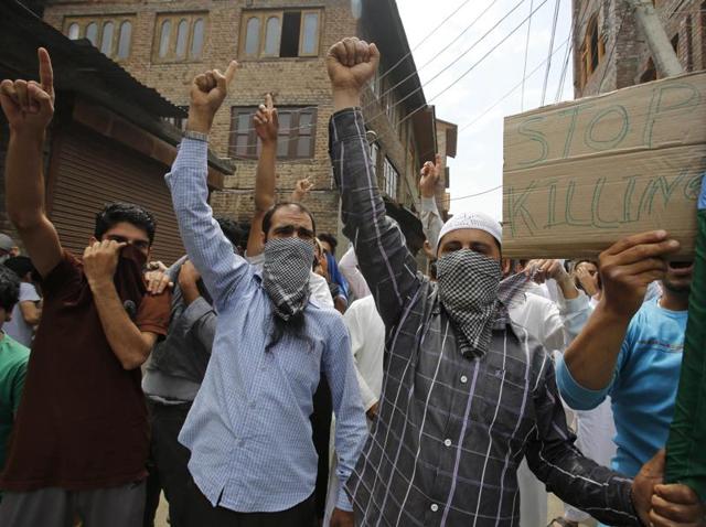 Kashmiri protesters pelt stones at paramilitary soldiers and policemen in Srinagar on Friday, July 22, 2016. The violence began after Hizbul Mujahideen commander Burhan Wani was killed in an encounter on July 8. (AP Photo) Kashmiri protesters pelt stones at paramilitary soldiers and policemen in Srinagar on Friday, July 22, 2016. The violence began after Hizbul Mujahideen commander Burhan Wani was killed in an encounter on July 8. (AP Photo)