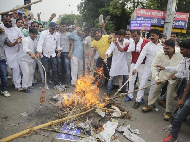 Bahujan Samaj Party supporters burn an effigy of BJP’s former Uttar Pradesh state vice-president Dayashankar Singh in Lucknow. A bounty was placed on his head for insulting the BSP’s chief and former chief minister Mayawati. (AP Photo) Bahujan Samaj Party supporters burn an effigy of BJP’s former Uttar Pradesh state vice-president Dayashankar Singh in Lucknow. A bounty was placed on his head for insulting the BSP’s chief and former chief minister Mayawati. (AP Photo)