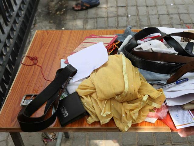 Belongings of aspirants kept outside an examination centre in Jaipur. (Himanshu Vyas/ Hindustan Times)