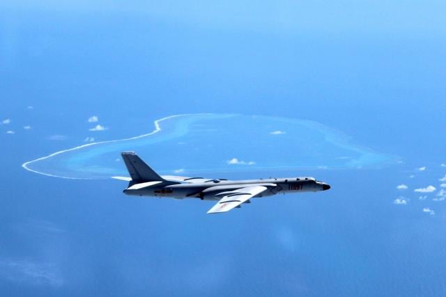 In this file photo released by Xinhua News Agency, a Chinese H-6K bomber is seen patrolling the islands and reefs in the South China Sea. (AP File Photo) In this file photo released by Xinhua News Agency, a Chinese H-6K bomber is seen patrolling the islands and reefs in the South China Sea. (AP File Photo)