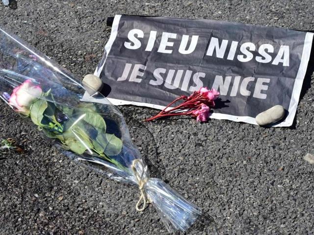 This picture taken on July 16, 2016 shows a rose and a sign reading "Je suis Nice" (I am Nice) placed near a stain on the pavement on la Promenade des Anglais in tribute to the victims of the deadly Bastille Day attack. (AFP) This picture taken on July 16, 2016 shows a rose and a sign reading "Je suis Nice" (I am Nice) placed near a stain on the pavement on la Promenade des Anglais in tribute to the victims of the deadly Bastille Day attack. (AFP)
