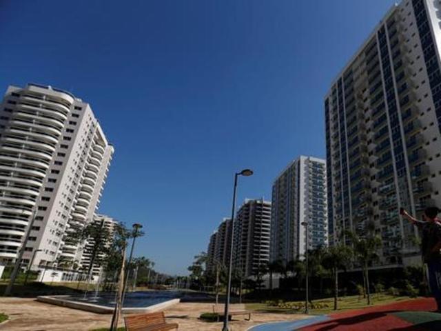 Workers click a selfie at the Olympic Village in Rio de Janeiro, Brazil. (Reuters Photo)