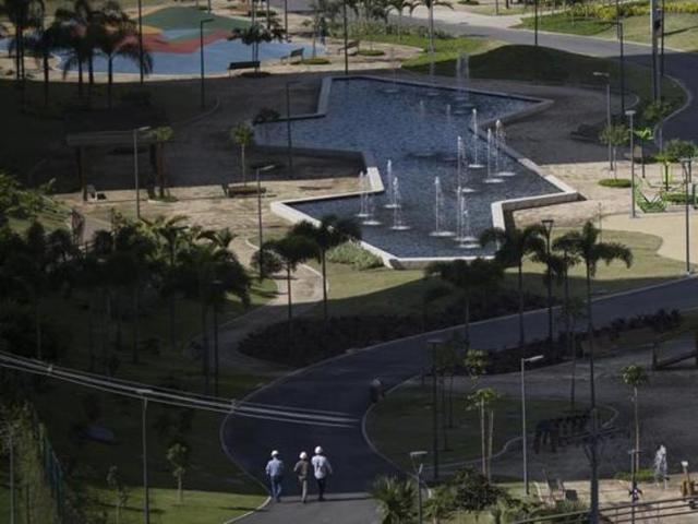 People walk after the opening ceremony of the Olympic Village in Rio de Janeiro, Brazil. (AP Photo)