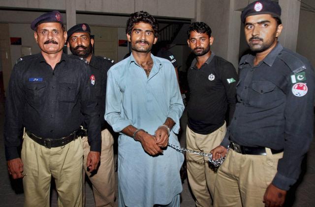 Pakistani police officers present Waseem Azeem, the brother of slain model Qandeel Baloch, before the media following his arrest at a police station in Multan, Pakistan. (AP Photo)