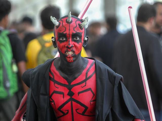 A young man plays the part of Darth Maul from Star Wars. (AFP) A young man plays the part of Darth Maul from Star Wars. (AFP)