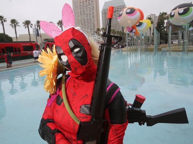 Anna Smith is dressed as the character Deadpool from Marvel Comics. Don’t miss the Powerpuff Girls floating behind the merc with a mouth. (AFP) Anna Smith is dressed as the character Deadpool from Marvel Comics. Don’t miss the Powerpuff Girls floating behind the merc with a mouth. (AFP)