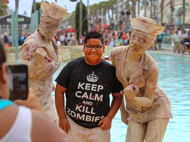 Carlos Plafencia, 11, gets his photo taken with scary nurses from the movie Silent Hill. (AFP) Carlos Plafencia, 11, gets his photo taken with scary nurses from the movie Silent Hill. (AFP)