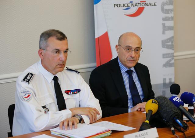 General director of the French national police Jean-Marc Falcone (R), flanked by public security central director (DCSP) Pscal Lalle, answers to journalists' questions on Sunday in Paris. (AFP)