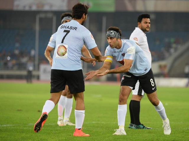 Ranbir Kapoor celebrates with teammate Shabbir Ahluwalia after they scored a goal during a charitable football match in New Delhi on July 24, 2016.  (AFP) 