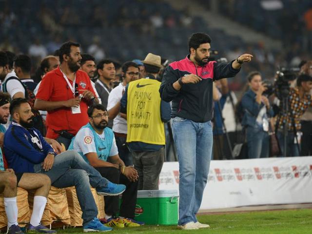 Abhishek Bachchan gestures towards his team players during the match. (AFP) 