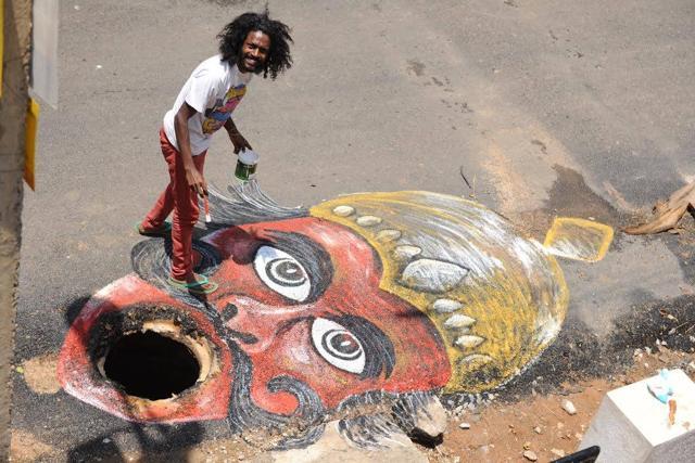 The work of art, when viewed from the top, looked as if Yamaraj was waiting to gulp down commuters. (Photo: Baadal Nanjundaswamy’s Facebook page) The work of art, when viewed from the top, looked as if Yamaraj was waiting to gulp down commuters. (Photo: Baadal Nanjundaswamy’s Facebook page)