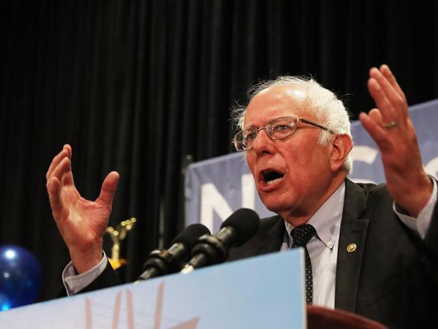 Senator Bernie Sanders addresses the New York delegation at the Democratic National Convention (DNC) on July 26, 2016 in Philadelphia, Pennsylvania. The convention officially began on Monday and is expected to attract thousands of protesters, members of the media and Democratic delegates. (AFP) Senator Bernie Sanders addresses the New York delegation at the Democratic National Convention (DNC) on July 26, 2016 in Philadelphia, Pennsylvania. The convention officially began on Monday and is expected to attract thousands of protesters, members of the media and Democratic delegates. (AFP)