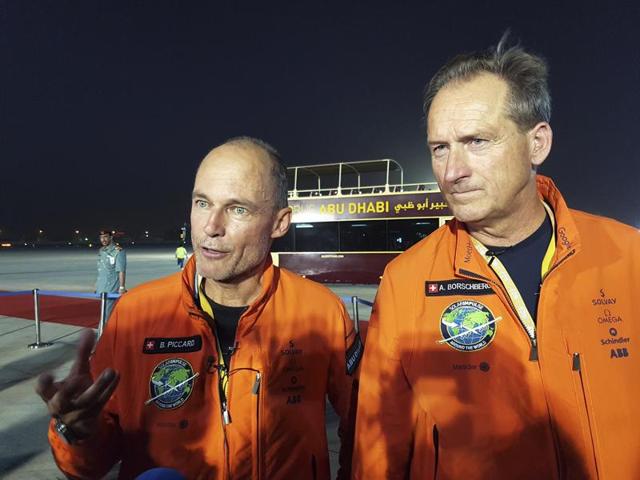 Pilots Andre Borschberg (L) and Bertrand Piccard celebrate after their arrival on Solar Impulse 2, a solar powered plane, at an airport in Abu Dhabi, United Arab Emirates July 26(REUTERS) Pilots Andre Borschberg (L) and Bertrand Piccard celebrate after their arrival on Solar Impulse 2, a solar powered plane, at an airport in Abu Dhabi, United Arab Emirates July 26(REUTERS)