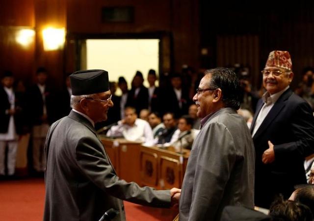 Khadga Prasad Sharma Oli shakes hand with Prachanda . The Maoist leader tells Hindustan Times his priority will be concluding the peace process. (Reuters) Khadga Prasad Sharma Oli shakes hand with Prachanda . The Maoist leader tells Hindustan Times his priority will be concluding the peace process. (Reuters)