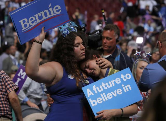 Two supporters of Bernie Sanders hug at the end of his speech (Reuters) Two supporters of Bernie Sanders hug at the end of his speech (Reuters)