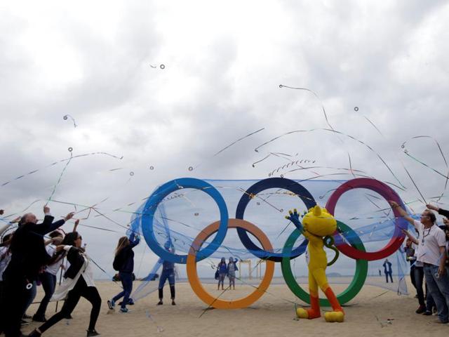 The 2016 Rio Olympics mascot Vinicius (C) attends the inauguration ceremony of the Olympic Rings placed at Copacabana Beach in Rio de Janeiro. (Reuters photo) The 2016 Rio Olympics mascot Vinicius (C) attends the inauguration ceremony of the Olympic Rings placed at Copacabana Beach in Rio de Janeiro. (Reuters photo)
