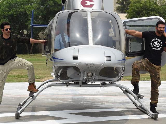 Varun Dhawan and John Abraham landed right in the middle of the ground to promote Dishoom in style! (AFP)