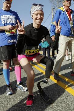 In this April 18, 2016, Adrianne Haslet poses at the starting line in Hopkinton, Mass., before running in the 120th Boston Marathon. (AP File)