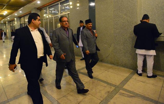 Nepalese Maoist chairman Pushpa Kamal Dahal, known as Prachanda, (C), leaves the Parliament building in Kathmandu on July 24, 2016. (AFP) Nepalese Maoist chairman Pushpa Kamal Dahal, known as Prachanda, (C), leaves the Parliament building in Kathmandu on July 24, 2016. (AFP)