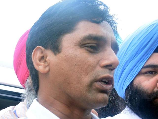 AAP MLA Naresh Yadav in police custody in Sangrur on Monday. (Bharat Bhushan/HT Photo) AAP MLA Naresh Yadav in police custody in Sangrur on Monday. (Bharat Bhushan/HT Photo)