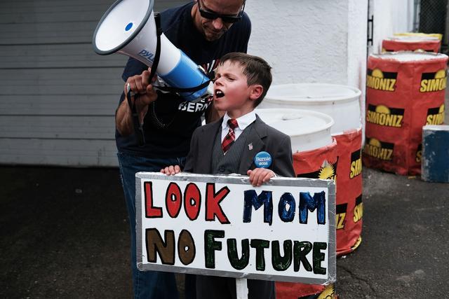 A young Bernie Sanders supporters participates in a march towards FDR Park on the first day of the Democratic National Convention (DNC) in Philadelphia, Pennsylvania. (AFP Photo) A young Bernie Sanders supporters participates in a march towards FDR Park on the first day of the Democratic National Convention (DNC) in Philadelphia, Pennsylvania. (AFP Photo)