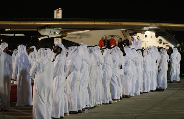 Solar Impulse 2, the solar powered plane, and crew are greeted upon arrival at Al Batin Airport in Abu Dabi to complete its world tour flight on Tuesday. (AFP) Solar Impulse 2, the solar powered plane, and crew are greeted upon arrival at Al Batin Airport in Abu Dabi to complete its world tour flight on Tuesday. (AFP)