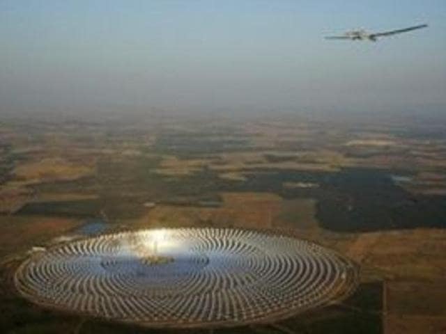 Andre Boschberg flies the Solar Impulse 2 over the Gemasolar Thermosolar Plant in Seville, Spain after taking off from the San Pablo airport towards Cairo in Egypt on July 11, 2016. (Reuters file photo) 