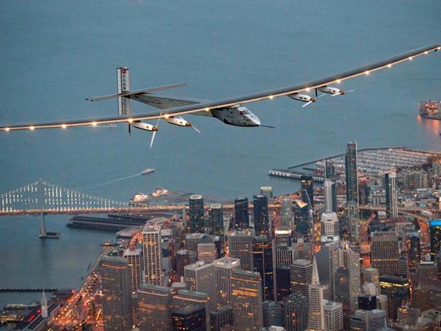 FILE - In this April 23, 2016 file photo, Solar Impulse 2 flies over San Francisco at the end of its journey from Hawaii, part of its attempt to circumnavigate the globe. The next leg of the solar-powered around-the-world flight is scheduled to start from Mountain View, Calif., Monday, May 2, 2016, at 5 a.m. PDT, bound for Phoenix.(AP Photo/Noah Berger, File) (AP) 