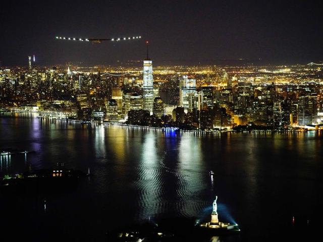 The voyage began in March 2015 from Abu Dhabi and took stops across the globe as it flew over for 42,000km across four continents, two oceans and three seas. This picture shows Solar Impulse 2 approaching New York City for landing at Kennedy International Airport with Andre Borshberg at the control.  (AFP) 