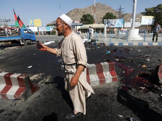 Men mourn over the coffin of a victim a day after a suicide attack in Kabul on July 23. (Reuters) Men mourn over the coffin of a victim a day after a suicide attack in Kabul on July 23. (Reuters)