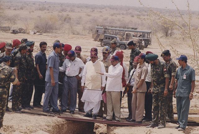 In this file photo Prime Minister AB Vajpayee, flanked by APJ Abdul Kalam and R Chidambaram inspects the site of the nuclear fission blast at Pokhran in Thar desert . (PTI photo)