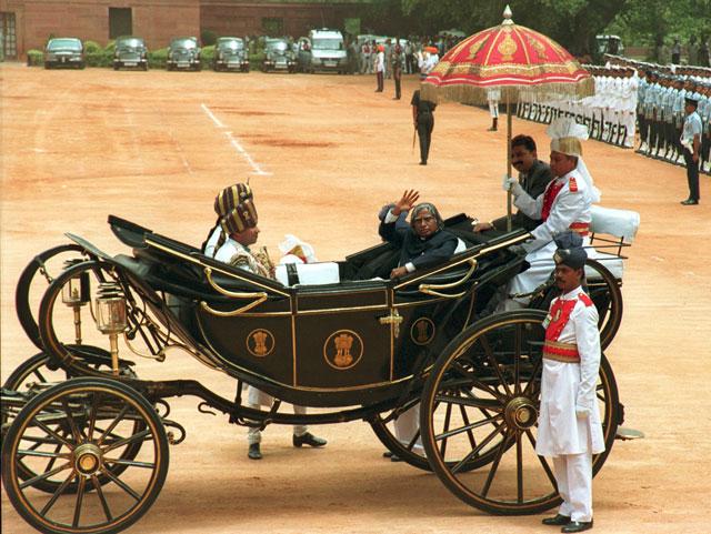 In this photo, President APJ Abdul Kalam waves while traveling in horse carriage at the ceremonial reception in the Forecourt of Rashtrapati Bhavan after the swearing ceremony in New Delhi. (Photo SN Sinha/HT)