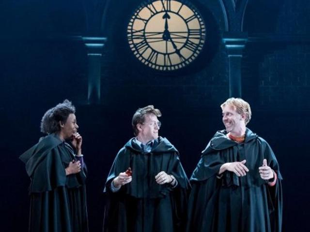 Harry, Ron and Hermione share a light moment. In robes. Like the good old days. (Twitter) 