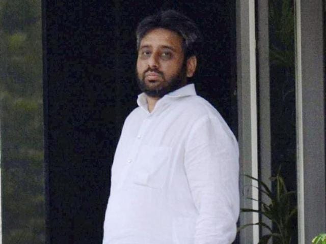 AAP MLA Amanatullah Khan at the police station after his arrest on charges of threatening a woman with rape, murder in New Delhi. (PTI) AAP MLA Amanatullah Khan at the police station after his arrest on charges of threatening a woman with rape, murder in New Delhi. (PTI)