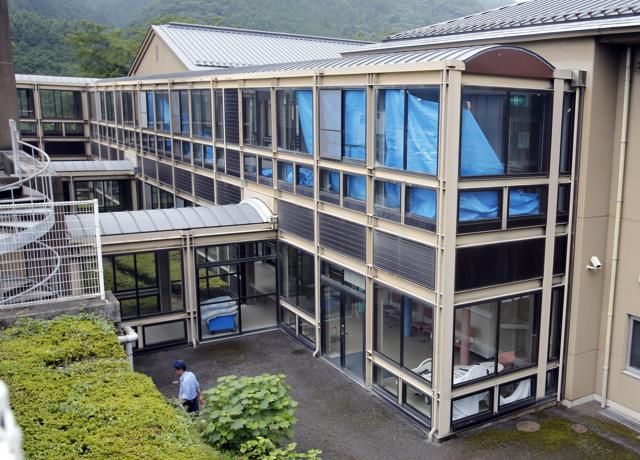 A police officer walks at the Tsukui Yamayuri-en, a facility for the mentally disabled where a number of people were killed and dozens injured in a knife attack, in Sagamihara, outside of Tokyo. (AP Photo) A police officer walks at the Tsukui Yamayuri-en, a facility for the mentally disabled where a number of people were killed and dozens injured in a knife attack, in Sagamihara, outside of Tokyo. (AP Photo)